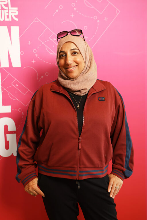 Shireen Ahmed standing in front of pink background